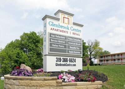 Glenbrook Centre Apartments. Cedar Rapids Iowa. Property sign. Apartments. Office or retail space. Green grass. Flowers.